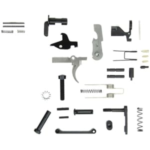 TacFire AR-15 lower parts kit laid out showing trigger, hammer, pins; no grip included