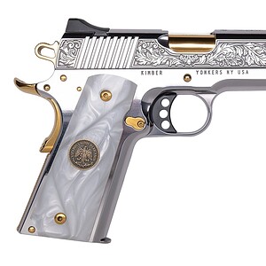 Custom engraved silver and gold firearm with pearl grip and intricate design.